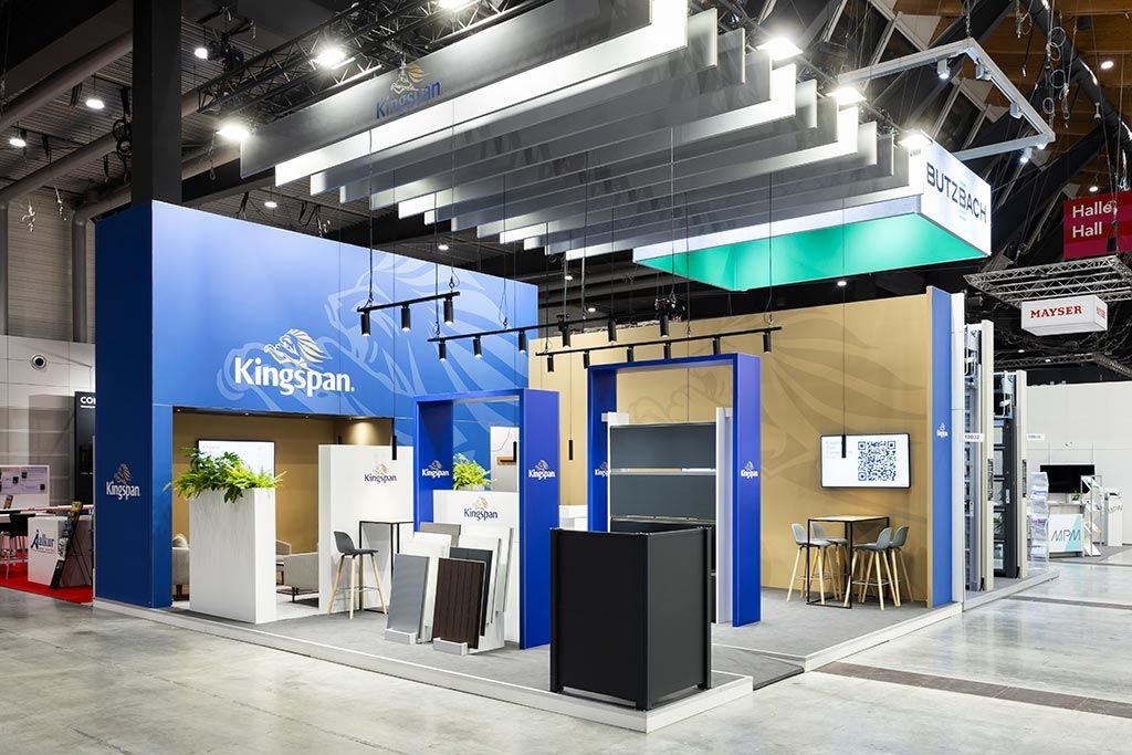 Kingspan stand at R+T Stuttgart with blue walls, hanging baffles and product samples