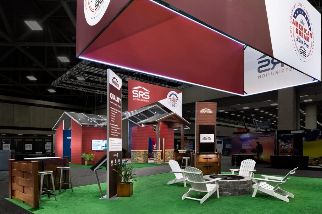 SRS Distribution stand at IRE with a lit red hanging sign, fire pit seating and house-style rooms