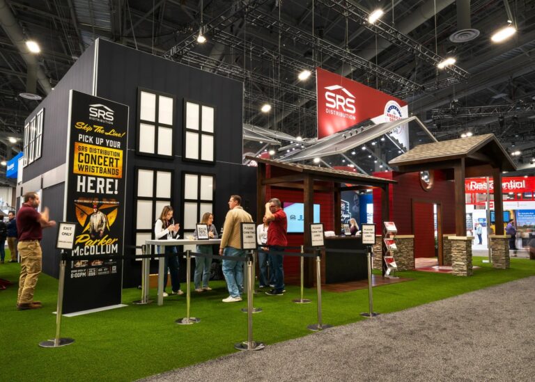 SRS Distribution stand with house facades, porch structure and artificial grass at IRE 2026